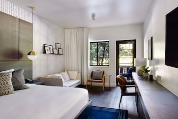 Down comforters, individually decorated, individually furnished, desk at Kaskades Hotel South Beach