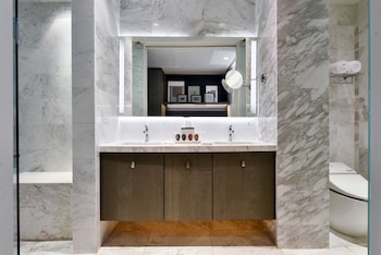 Down comforters, individually decorated, individually furnished, desk at Kaskades Hotel South Beach