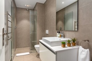 Shower, hair dryer, towels, toilet paper