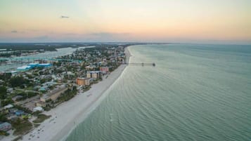 On the beach, sun loungers, beach towels
