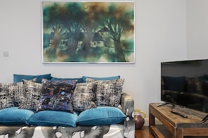 Apartment (2 Bedrooms) | Living area | 32-inch flat-screen TV with cable channels, TV