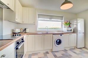 Fridge, microwave, oven, cookware/dishes/utensils