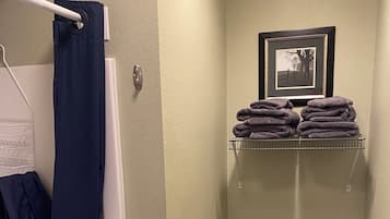 Shower, hair dryer, towels, toilet paper