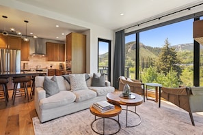 Deluxe Condo, 2 Bedrooms, Mountain View | Living area | 50-inch Smart TV with satellite channels, TV, fireplace - Riverfront Lodge (Avon)