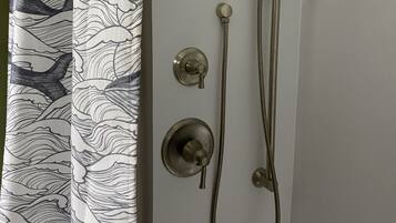 Combined shower/tub, hair dryer, towels, soap