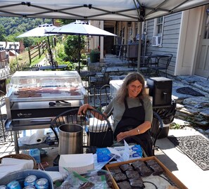 Guests can enjoy al fresco dining on the patio, complete with a grill station and comfortable seating.