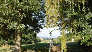 A rural pathway surrounded by trees and a lamp post. - Luxury gite for adult couples, peaceful, open views, large swimming pool (Boisse)