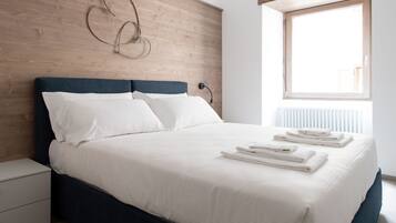 Apartment, Multiple Beds, Kitchenette, City View | 2 bedrooms, iron/ironing board, free WiFi, bed sheets