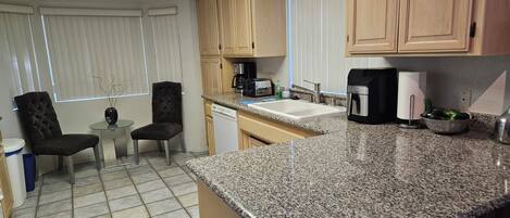 Coffee/tea maker, fridge, microwave, oven