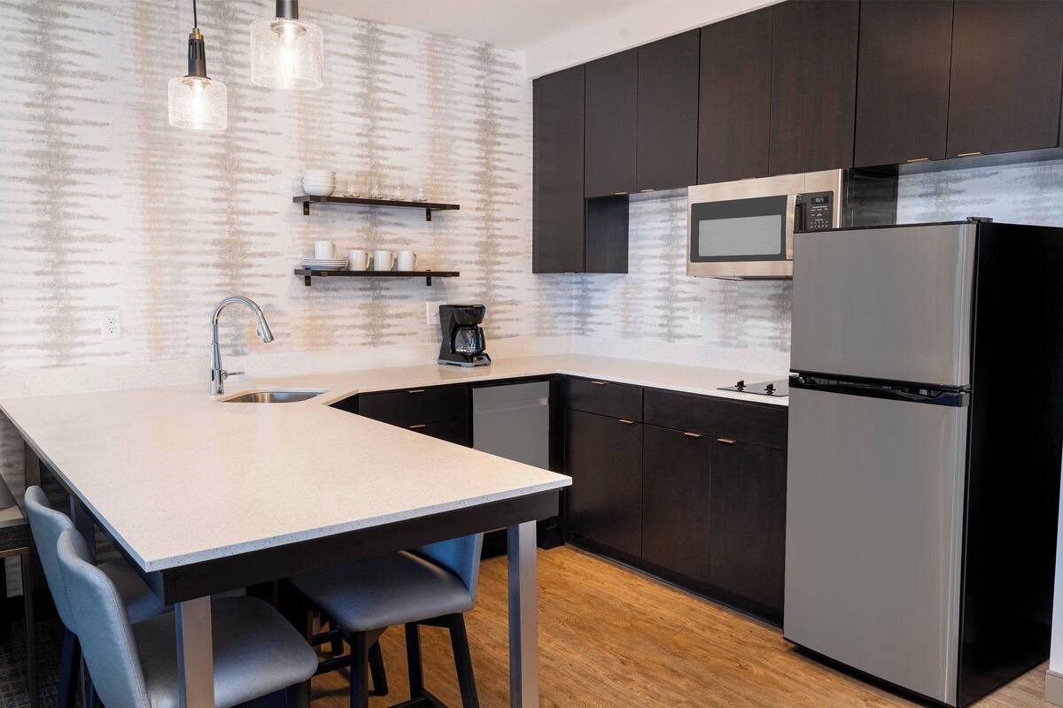 full-sized fridge, microwave, stovetop, dishwasher