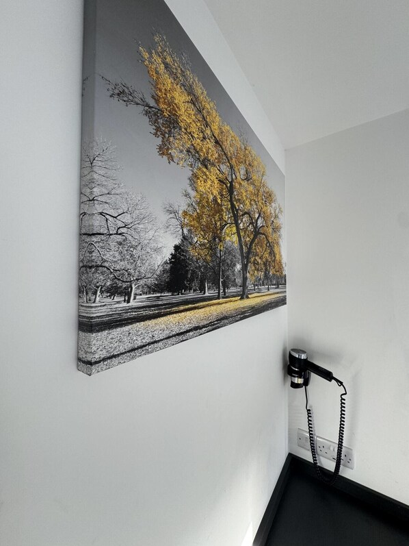 A painting of a park scene with trees and a pathway. - City & Station Stays at Gulland House by Pureserviced (Plymouth)