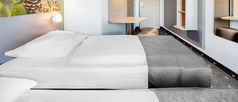 Een bureau, geluiddichte muren, gratis wifi, beddengoed