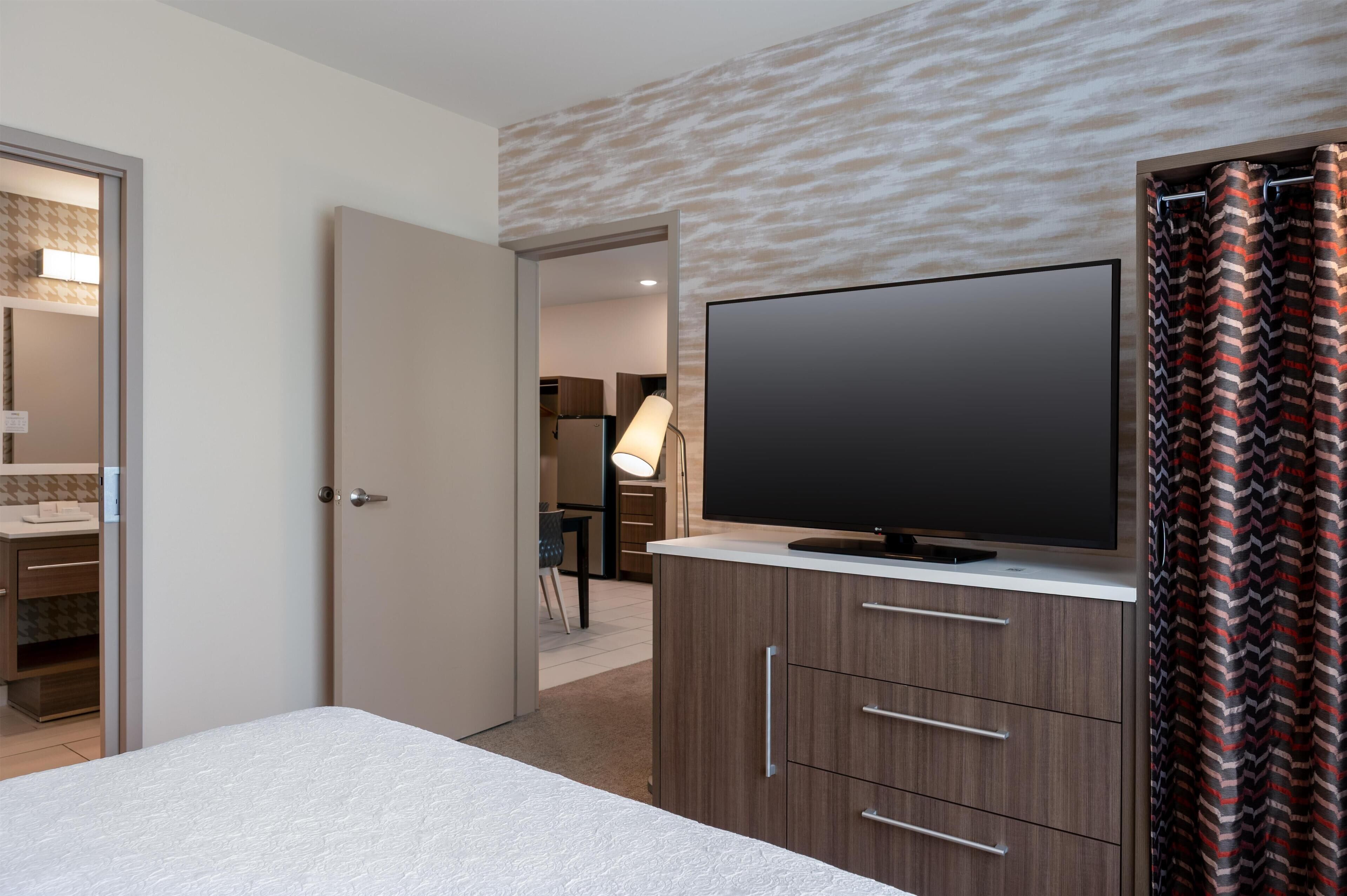 Suite, 1 Bedroom, Non Smoking | Desk, iron/ironing board, free cots/infant beds, bed sheets