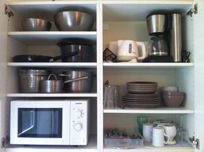 Fridge, microwave, stovetop, coffee/tea maker