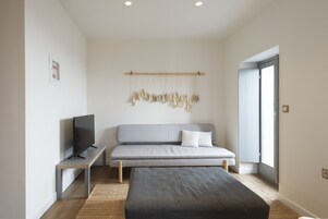 Superior Suite | Living area | Flat-screen TV