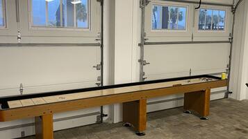 Enjoy a game of pool in this spacious room with a long, narrow pool table.