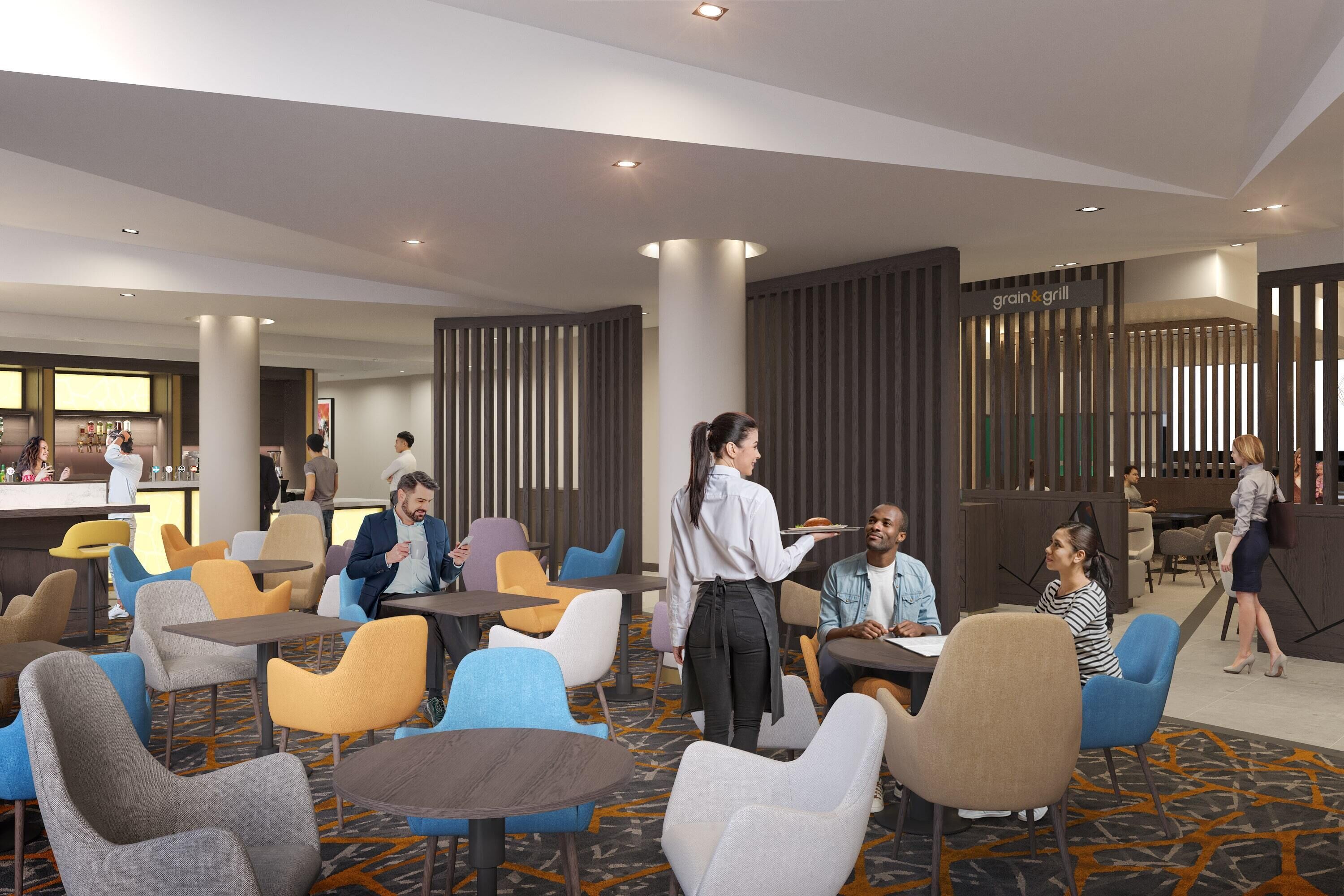A modern hotel lobby with multiple seating areas, a bar, and a restaurant named 'grain & grill'.