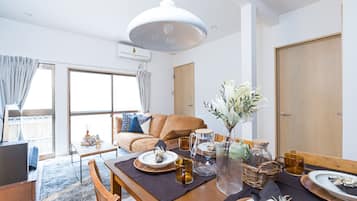 Apartment, Non Smoking | Living area | Flat-screen TV