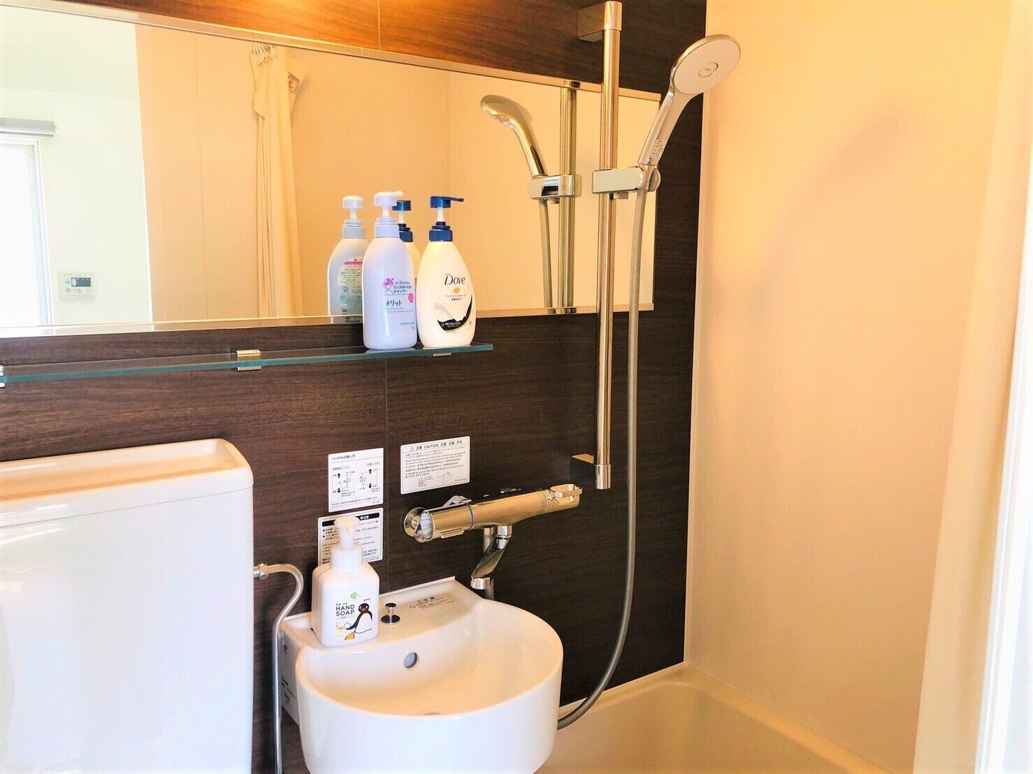Combined shower/tub, free toiletries, hair dryer, slippers