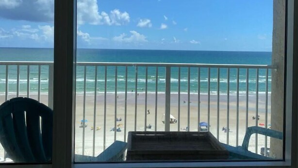 A balcony with a view of the beach and ocean. - Cute Studio!  Remodeled!  Direct Ocean Front! Pirates Cove 6th Floor (Daytona Beach)