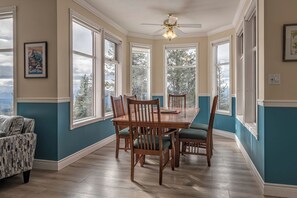 Enjoy meals in this spacious dining area with a large table and six comfortable chairs.