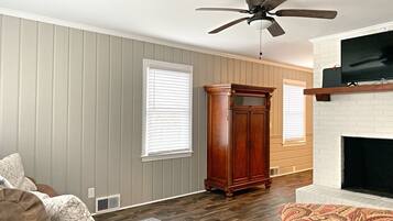 Smart TV, fireplace, books, offices