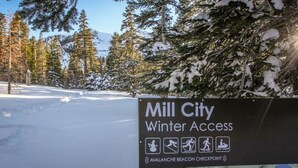 A sign for Mill City Winter Access with symbols for snowshoeing, hiking, and wheelchair access. - 1+Loft on Ski Back Trail at Canyon Lodge w/ Garage! (Mammoth Lakes)