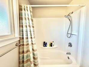 Combined shower/tub, hair dryer, towels, soap