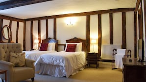 A bedroom with two beds, a chair, a desk, and a mirror. - 4 bedroom accommodation in Pulham Market, near Diss (Pulham Market, near Diss)