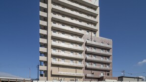 A multi-story hotel with a sign reading "SUPERHOTEL". - Super Hotel Kanku Kumatoriekimae (Kumatori)
