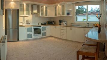 Villa | Private kitchen | Full-size fridge, oven, stovetop, dishwasher