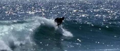 A person surfing a wave in the ocean.