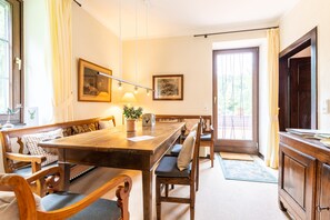 Enjoy meals in this dining area with a large table and comfortable seating for all.