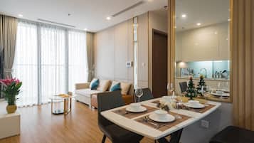 Apartment, 1 Bedroom | Living area | 55-inch Smart TV with cable channels, TV