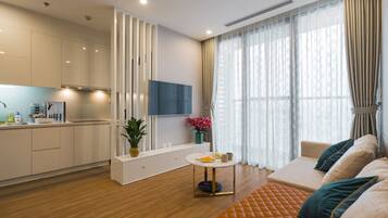 Apartment, 1 Bedroom | Living area | 55-inch Smart TV with cable channels, TV