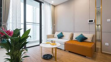 Apartment, 1 Bedroom | Living area | 55-inch Smart TV with cable channels, TV
