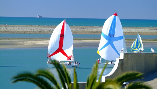 Two sailboats on a calm sea with a beach in the background. - Kimberley Three - Nelson Waterfront Apartment - Free Cancellation Available Here (Nelson)