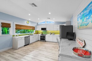 Fridge, stovetop, dishwasher, coffee/tea maker