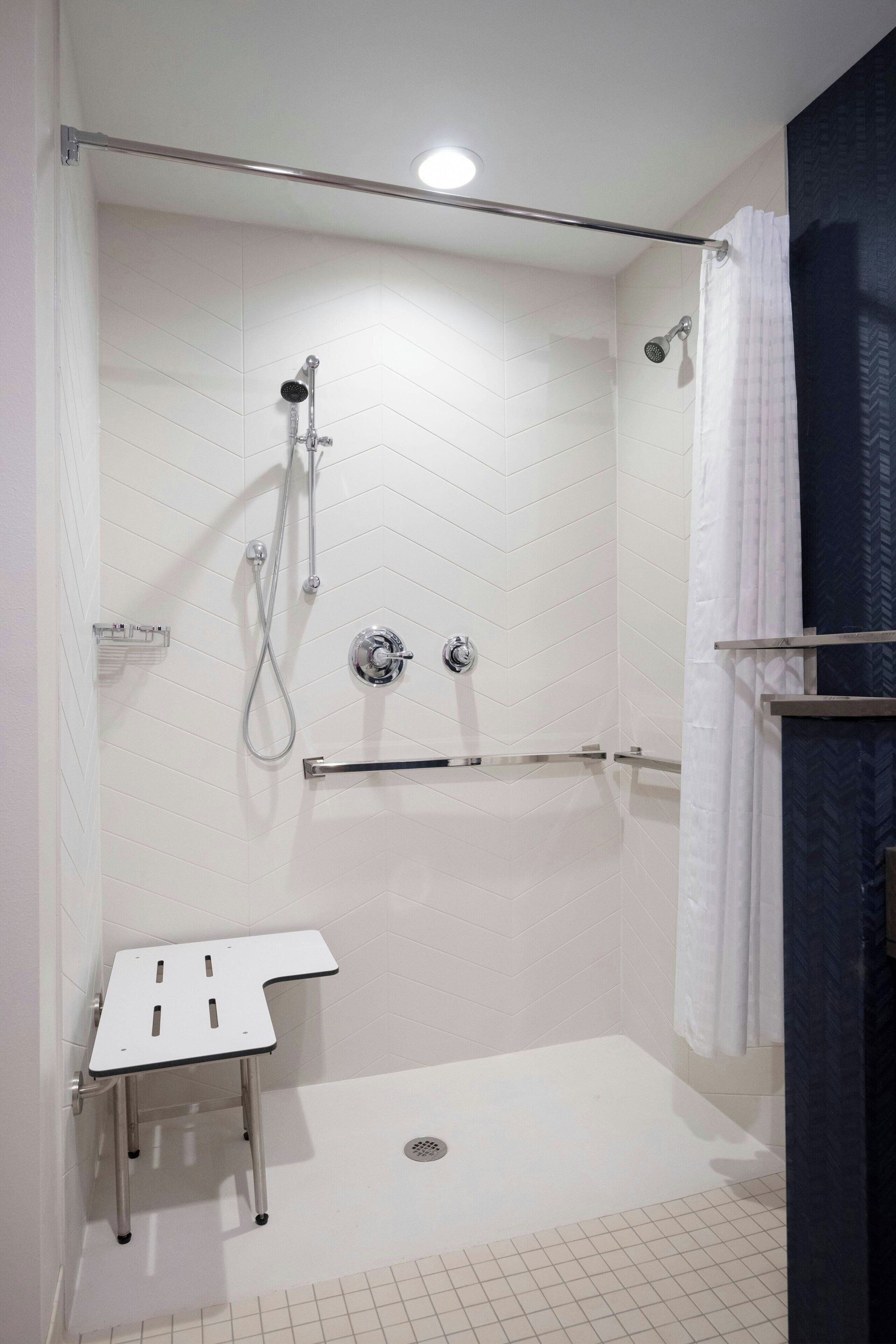 room, 1 king bed, non smoking (mobility/hearing access, roll-in shwr) | bathroom | shower, free toiletries, hair dryer, towels