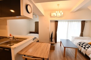 Deluxe-Apartment | Wohnbereich | Flachbildfernseher