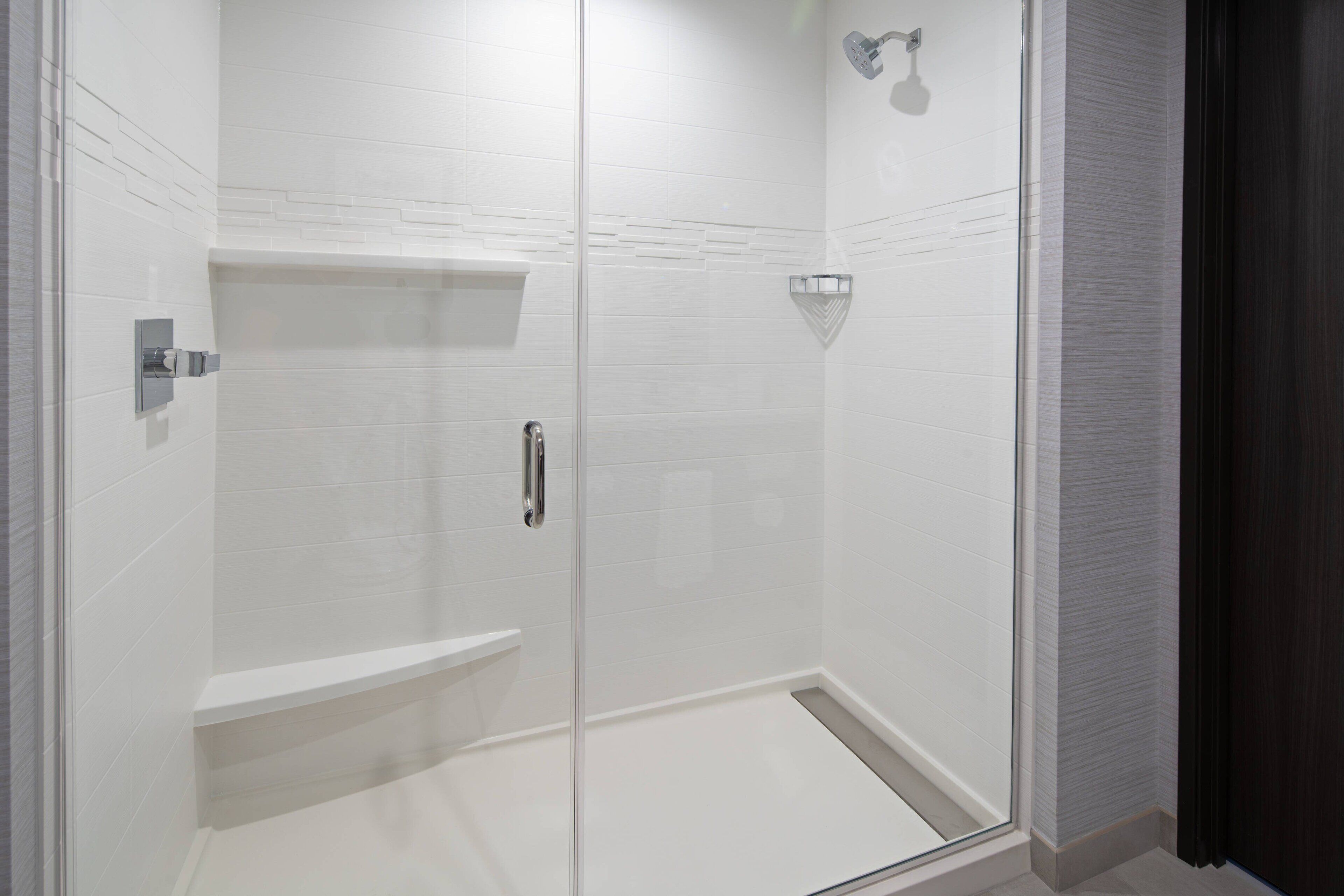 shower, hydromassage showerhead, hair dryer, towels