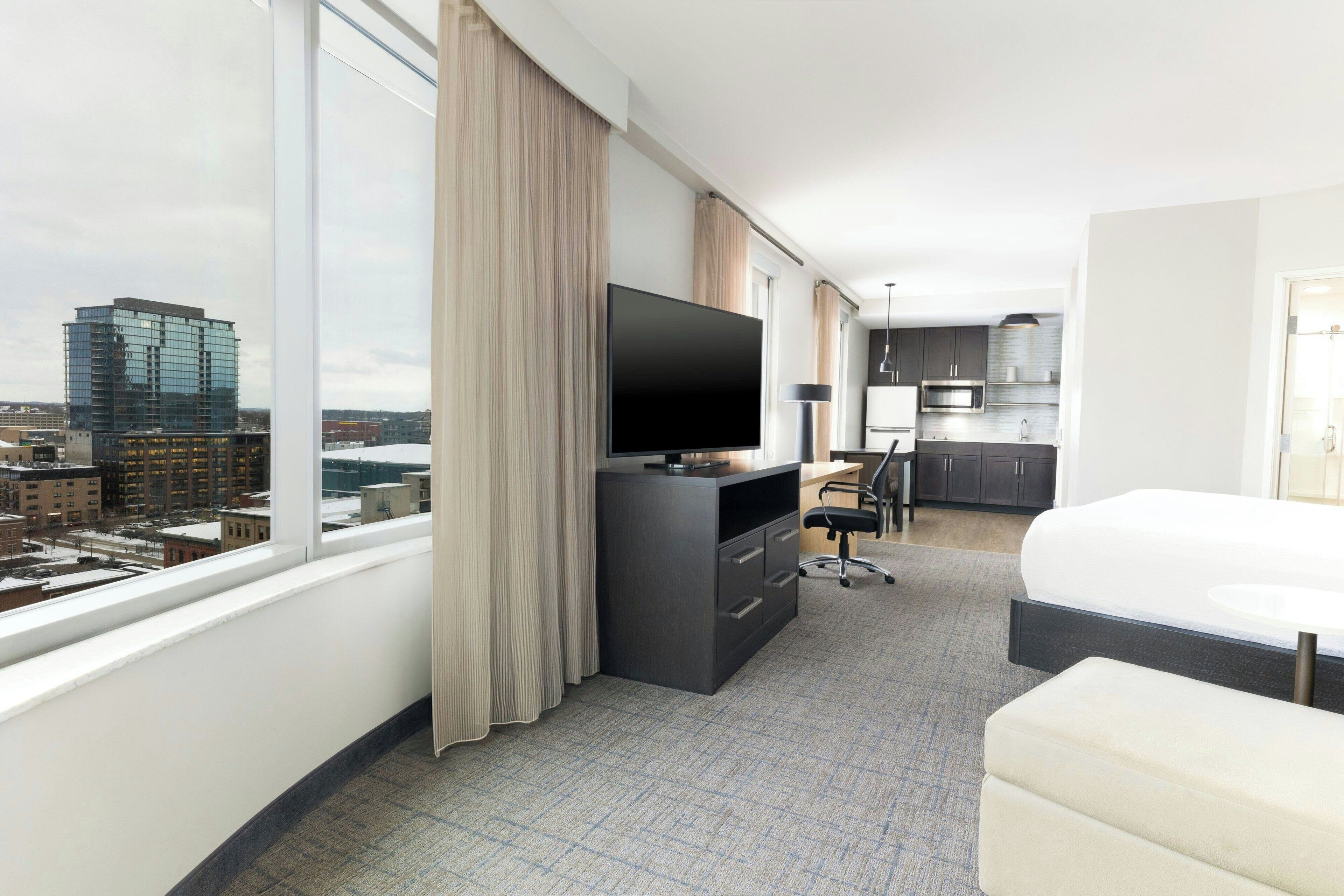 hypo-allergenic bedding, desk, laptop workspace, blackout curtains