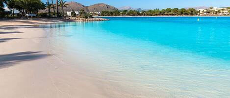 On the beach, sun loungers, beach towels