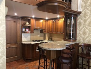 Fridge, microwave, electric kettle, cookware/dishes/utensils