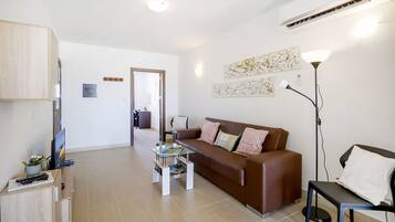 Superior Apartment | Living area | 42-inch LED TV with digital channels, TV