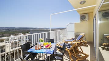Apartamento superior | Terraço/pátio