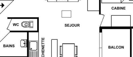 Plano de planta que muestra una cocina, un aseo, balcón y una cabaña.