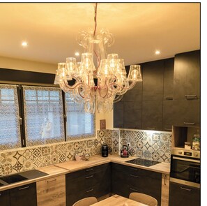 Enjoy meals at the central island with a sink and dining table for six.