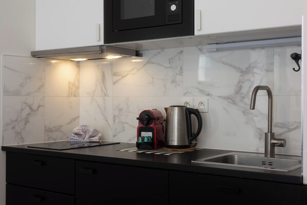 Fridge, microwave, coffee/tea maker, toaster
