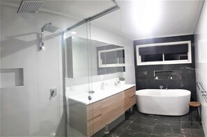 Bathtub, hair dryer, towels, soap
